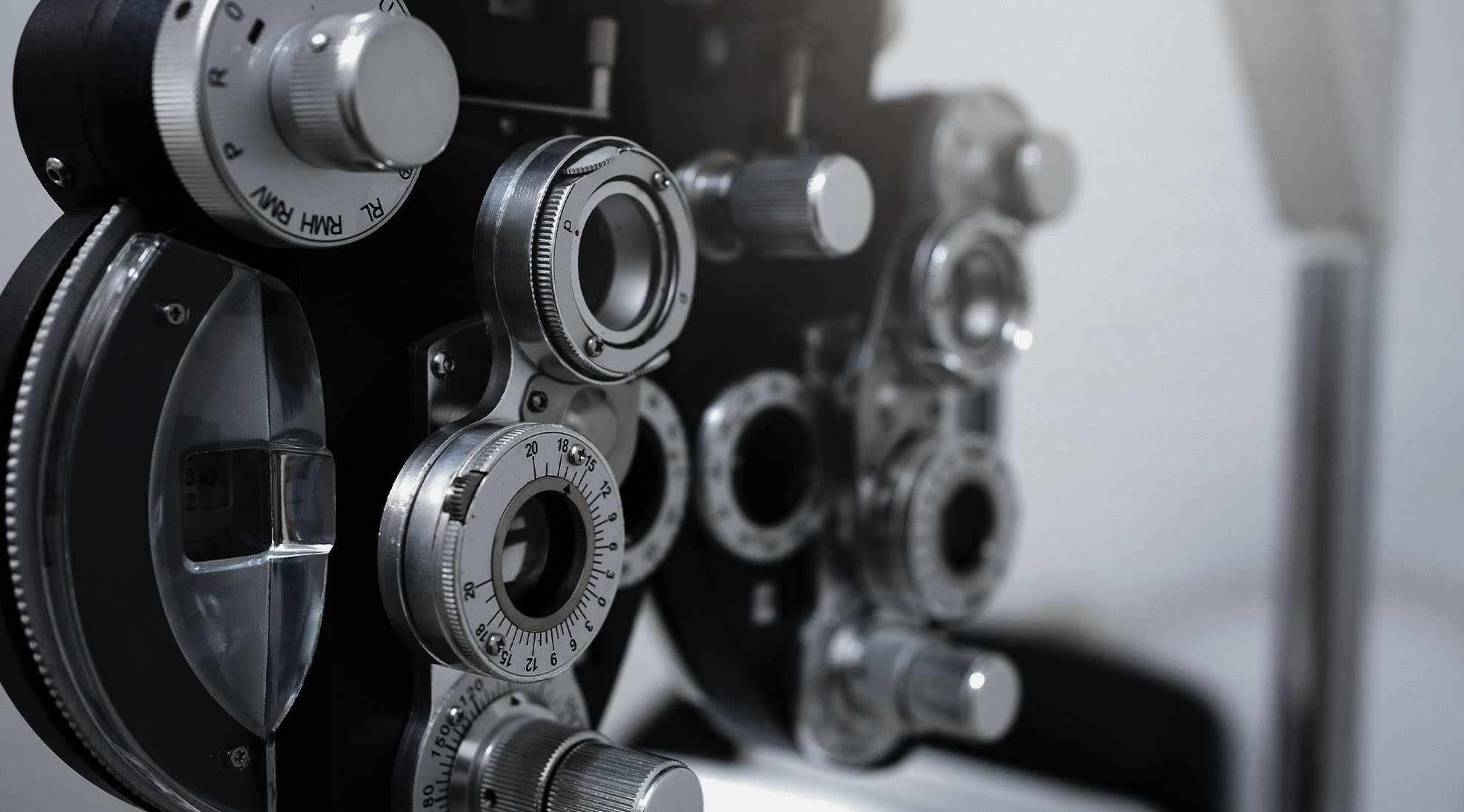 Eye exam equipment close up in black and white